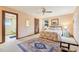 Cozy bedroom featuring a decorative rug, closet, and ensuite bathroom at 2112 Laurence Dr, Clearwater, FL 33764