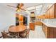 Spacious kitchen features custom wood cabinets, tile floor, and modern appliances at 2112 Laurence Dr, Clearwater, FL 33764