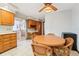 Eat-in kitchen featuring a round table and access to the porch, plus ample wood cabinetry at 2112 Laurence Dr, Clearwater, FL 33764