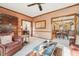 Classic living room with plush seating, a view of the dining room, and traditional furnishings at 2112 Laurence Dr, Clearwater, FL 33764