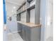 Elegant bar area with a built-in cabinet, butcher block countertop, open shelves, and a stylish mirrored backsplash at 2121 Park N St, St Petersburg, FL 33710