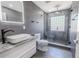 Bathroom boasts a modern vanity, decorative tile and a frameless glass shower at 2121 Park N St, St Petersburg, FL 33710