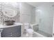 Modern bathroom features a stylish vessel sink, elegant tile work, and a glass-enclosed shower at 2121 Park N St, St Petersburg, FL 33710