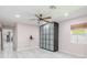 Bright bedroom with a ceiling fan, a large storage unit, and a window with wood blinds at 2121 Park N St, St Petersburg, FL 33710