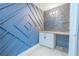 Hallway features a custom accent wall, white cabinets, and butcher block countertops at 2121 Park N St, St Petersburg, FL 33710