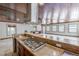Kitchen with granite countertops, stone accents, and direct view of the sunroom through the bar at 2121 Park N St, St Petersburg, FL 33710