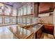Kitchen bar featuring granite countertops, modern appliances, and access to a large sunroom with tiled floors at 2121 Park N St, St Petersburg, FL 33710