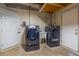 A laundry room features a washer, dryer, and utility sink with neutral flooring at 2121 Park N St, St Petersburg, FL 33710