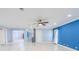 Bright living room features sleek flooring, modern ceiling fan, and a fresh, inviting atmosphere at 2121 Park N St, St Petersburg, FL 33710