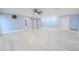 Open living room showcasing bright lighting, modern floors, and easy access to other living spaces at 2121 Park N St, St Petersburg, FL 33710