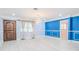 Bright living room with hardwood floors, stylish light fixture, and custom wall trim at 2121 Park N St, St Petersburg, FL 33710