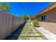 The walkway along the side of the house features decorative block and artificial grass at 2121 Park N St, St Petersburg, FL 33710