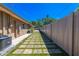 The property features a side yard with a walkway of bricks and artifical grass at 2121 Park N St, St Petersburg, FL 33710