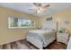 Well-lit bedroom offers a comfortable and inviting space with window views at 2401 Ecuadorian Way # 57, Clearwater, FL 33763