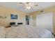Spacious bedroom featuring ceiling fan, closet and light yellow wall color at 2401 Ecuadorian Way # 57, Clearwater, FL 33763