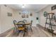 Dining area with table and seating for four, featuring updated decor and modern finishes at 2401 Ecuadorian Way # 57, Clearwater, FL 33763