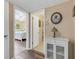 Hallway view of bedroom and bathroom and built in storage at 2401 Ecuadorian Way # 57, Clearwater, FL 33763