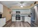 Contemporary kitchen features stainless steel appliances and modern fixtures at 2401 Ecuadorian Way # 57, Clearwater, FL 33763