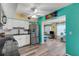 Bright kitchen with stainless steel appliances and view to living room at 2401 Ecuadorian Way # 57, Clearwater, FL 33763