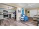 Open concept living and kitchen area boasts stainless appliances and updated floors at 2401 Ecuadorian Way # 57, Clearwater, FL 33763