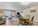 Cozy living room featuring a dining table and an inviting seating arrangement at 2401 Ecuadorian Way # 57, Clearwater, FL 33763
