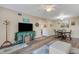 Well-lit living space features laminate floors, and combination living room and dining area at 2401 Ecuadorian Way # 57, Clearwater, FL 33763