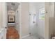 Bathroom featuring a glass-enclosed shower, tiled floors, and neutral decor at 2495 13Th N Ave, St Petersburg, FL 33713