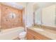 Cozy bathroom with stylish tile work, bathtub, and granite countertop sink at 250 Seagate Ct, Dunedin, FL 34698
