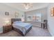 Cozy bedroom with large windows and a comfortable bed at 250 Seagate Ct, Dunedin, FL 34698
