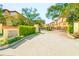 Community entrance with brick pillars, decorative signage, mature landscaping and gate at 250 Seagate Ct, Dunedin, FL 34698