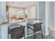 Eat-in kitchen featuring bar seating and modern finishes at 250 Seagate Ct, Dunedin, FL 34698