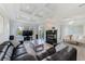 Spacious living room with fireplace, large windows, and open access to other areas at 250 Seagate Ct, Dunedin, FL 34698