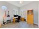 Office space with natural light, guitars, desk, and storage at 250 Seagate Ct, Dunedin, FL 34698