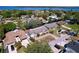 Spacious home with waterfront access, featuring lush landscaping and a brick driveway, surrounded by mature trees at 3105 S Canal Dr, Palm Harbor, FL 34684