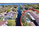 Beautiful waterfront home featuring a private pool and canal access, surrounded by lush landscaping at 3105 S Canal Dr, Palm Harbor, FL 34684