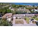 Beautiful aerial view of house with driveway, garage, front porch, and waterfront access at 3105 S Canal Dr, Palm Harbor, FL 34684