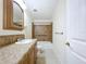 A clean, compact bathroom with neutral color at 3105 S Canal Dr, Palm Harbor, FL 34684