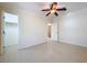 An empty bedroom with doors to a closet and hallway at 3105 S Canal Dr, Palm Harbor, FL 34684