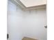 A white closet with basic clothing racks at 3105 S Canal Dr, Palm Harbor, FL 34684