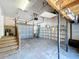 The garage has a utility area, a garage door, a staircase, and plenty of room for storage at 3105 S Canal Dr, Palm Harbor, FL 34684
