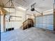The garage includes a garage door, stairs to the interior, plenty of light, and lots of open space at 3105 S Canal Dr, Palm Harbor, FL 34684