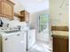 Charming laundry room featuring a modern washer and dryer at 3105 S Canal Dr, Palm Harbor, FL 34684