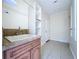 Bright laundry room with cabinet storage and tile flooring at 3105 S Canal Dr, Palm Harbor, FL 34684