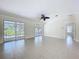 Living room with sliding doors and a ceiling fan at 3105 S Canal Dr, Palm Harbor, FL 34684