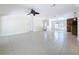 Living room boasts tile floors and connects with the kitchen at 3105 S Canal Dr, Palm Harbor, FL 34684