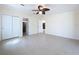 Large bedroom with tile flooring, multiple closets and bathroom access at 3105 S Canal Dr, Palm Harbor, FL 34684
