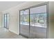 View of the screened-in patio from inside, accessible through sliding glass doors at 3105 S Canal Dr, Palm Harbor, FL 34684