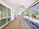 Extended screened-in porch overlooking a pool and backyard at 3105 S Canal Dr, Palm Harbor, FL 34684