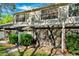 Exterior shot featuring a screened-in patio and tidy landscaping at 5100 Burchette Rd # 3403, Tampa, FL 33647