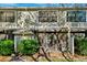 Back exterior view of townhome featuring a screened-in patio and landscaping at 5100 Burchette Rd # 3403, Tampa, FL 33647